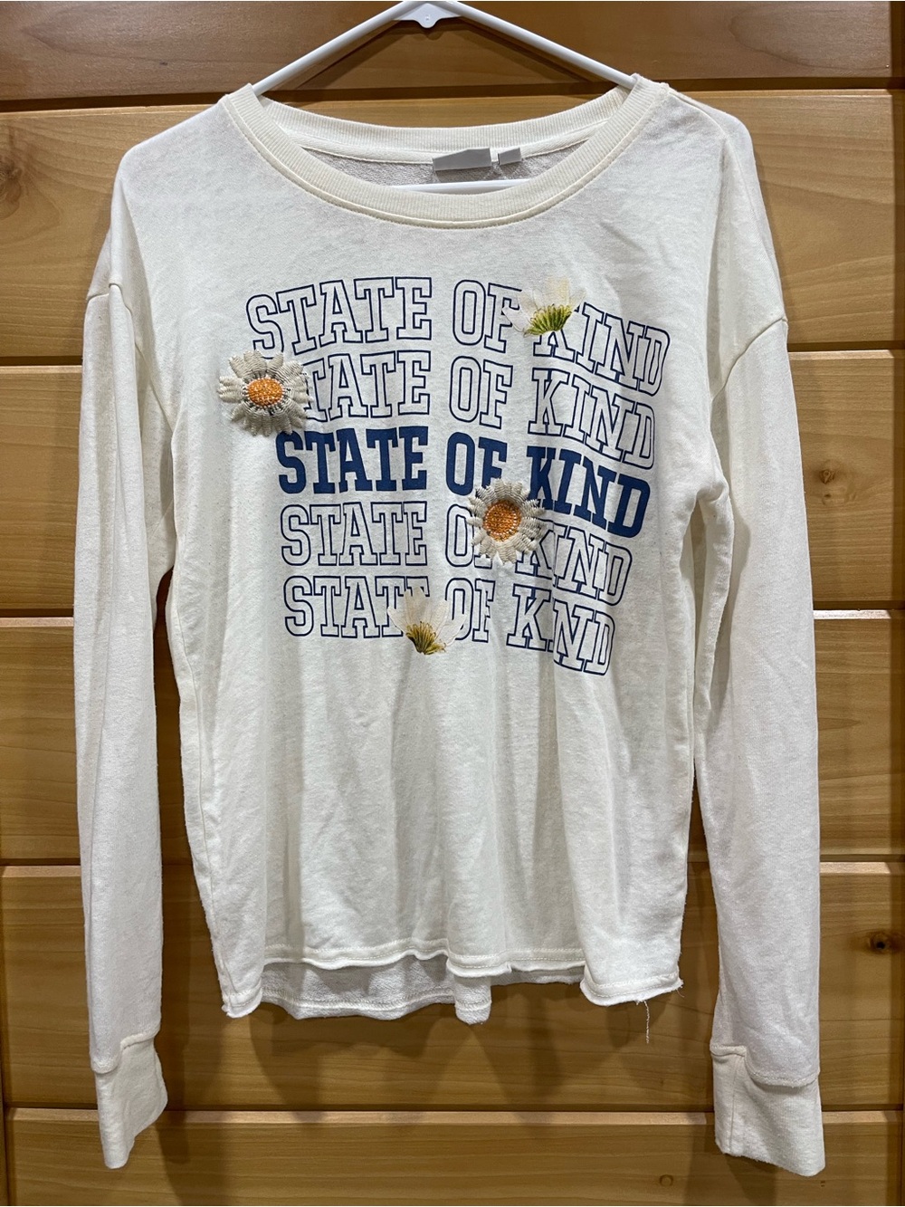 Cream Long-Sleeve "State of Kind" Graphic Tee with Daisy Embroidery